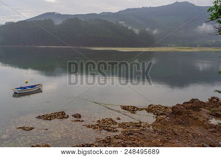 Landscape Of The Estuary Of Ortigueira With Boat And Rocks With Mussels. Carino. La Coruna Spain. Eu