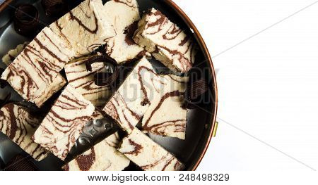 Halva With Cacao Pieces On A Plate Top View
