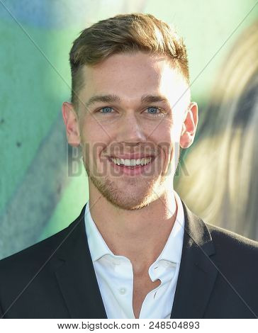 LOS ANGELES - JUN 26:  Taylor John Smith arrives to the HBO 'Sharp Objects' Premiere  on June 26, 2018 in Hollywood, CA                