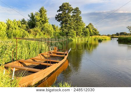 Lowland Nida River, Wooden Boat, Landscape Of The Nida Valley, Poland.