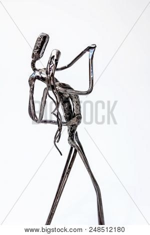 Figures Of Performers Made With Welded Black Metal Wire. Dancers Are Dancing Stylish With Sexy Passi