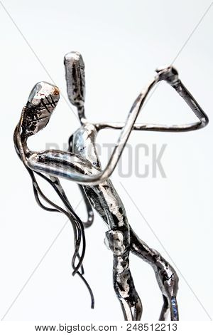 Figures Of Performers Made With Welded Black Metal Wire. Dancers Are Dancing Stylish With Sexy Passi