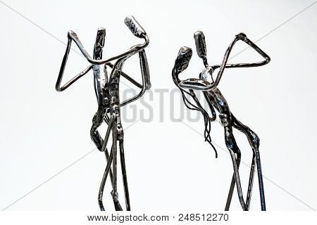 Figures Of Performers Made With Welded Black Metal Wire. Dancers Are Dancing Stylish With Sexy Passi