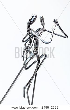 Figures Of Performers Made With Welded Black Metal Wire. Dancers Are Dancing Stylish With Sexy Passi