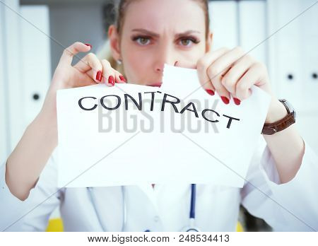 Hands Of Female Medicine Doctor Ripping Contract Closeup. Break The Rules - Failure Business Concept