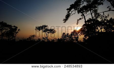 Beautiful Sunrise And Silhouette Tree In Mountain Of Thailand.