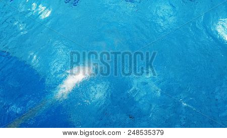 Fresh Blue Water In Swimming Pool Background.