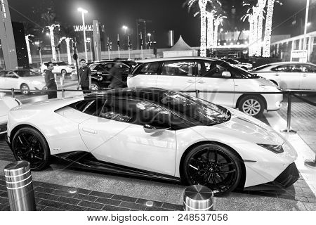 Dubai, Uae - December 23, 2017: Luxury Supercar Lamborghini Huricane Greeen Color Parked Next To Dub