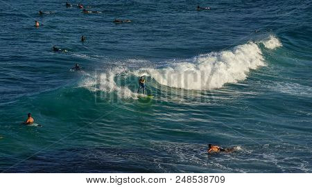 Australian Young Man And Lady Surfing At Tamarama Beach In Sydney, As Surfing Sport Is One Of Popula