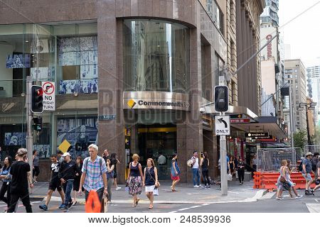 Commonwealth Bank On Corner Of  Margaret Street, Cbd Area With Crowd Of People Walking Across Street