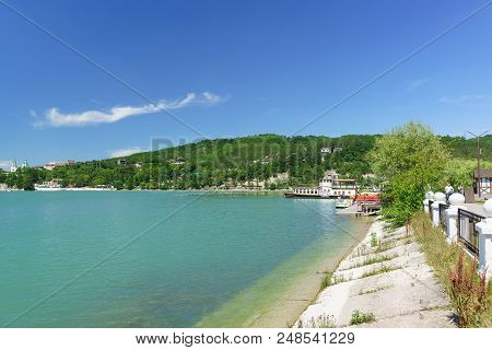 Pleasure Boats At The Pier Of The Picturesque Mountain Lake Abrau. Sunny Summer Day