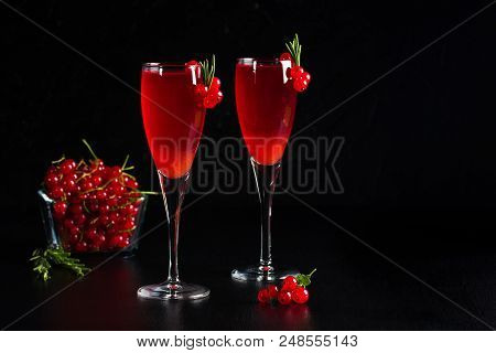 Two Glasses Of Redcurrant Wine Drink Juice Decorated With Rosemary And Berries, A Cup Of Redcurrant 