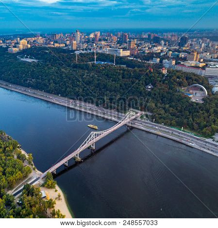 Panoramic View Of A Modern City With A River. Skyline Bird Eye Aerial View Of The Old Part Of The Ci