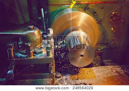 Shavings On The Details Close-up. Lathe, Metal Processing By Cutting On Industrial Equipment. Tinted