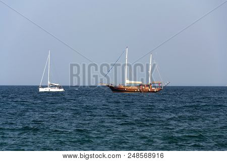 Monopoli, Italy - July 5 2018: Ship Yasemin Sultan From Mahagony Tree Sailing Near Beach Porta Vecch