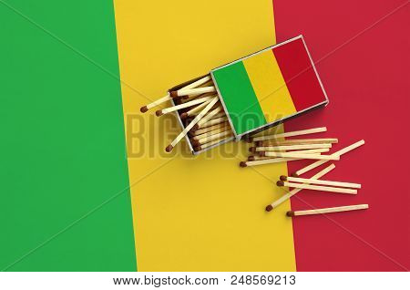 Mali Flag  Is Shown On An Open Matchbox, From Which Several Matches Fall And Lies On A Large Flag.