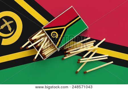Vanuatu Flag  Is Shown On An Open Matchbox, From Which Several Matches Fall And Lies On A Large Flag