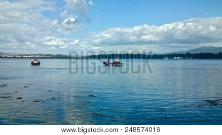 Some Fishing Boats Near A Toxa Island In O Grove Spain