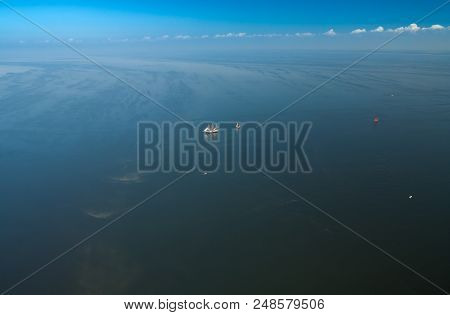 Two Lonely Sailboats In The Middle Of The Sea. Aerial View From Above.