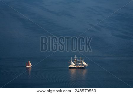 Two Lonely Sailboats In The Middle Of The Sea. Aerial View From Above.