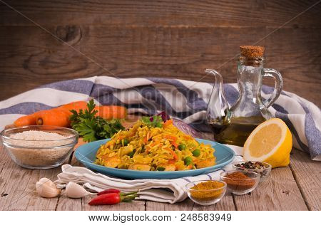 Nasi Goreng With Spices On Wooden Table.
