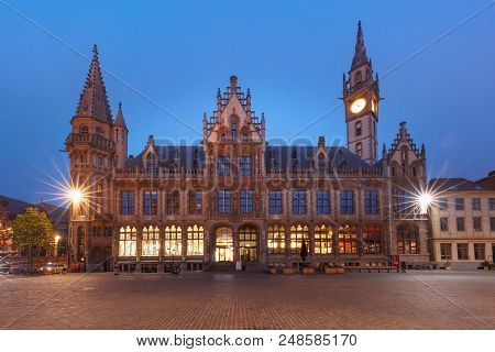 Former Building Of Post Office, Oude Postkantoor, With Clock Tower On Korenmarkt At Night, Ghent, Be