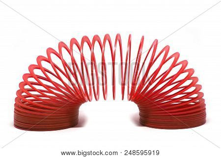 Bangkok, Thailand - March  20, 2018 : Red Slinky Spring Toy Isolated On White Background. Illustrati
