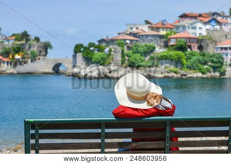 A tourist enjoys amazing view of Historical Amasra - Amasra town, Bartin - Turkey