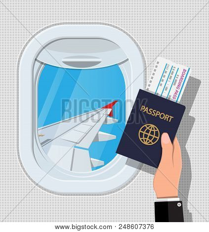 Window From Inside The Airplane. Hand With Passport And Ticket. Aircraft Porthole Shutter And Wing. 