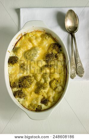 Casserole With Broccoli, Cauliflower And Cheese On A Light Background. Selective Focus.