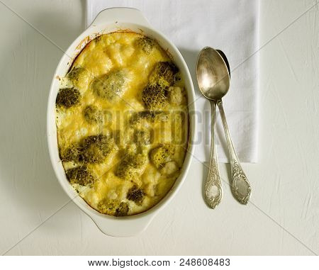 Casserole With Broccoli, Cauliflower And Cheese On A Light Background. Selective Focus.