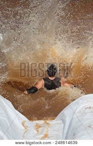 Mud Race Runners During Extreme Obstacle Races
