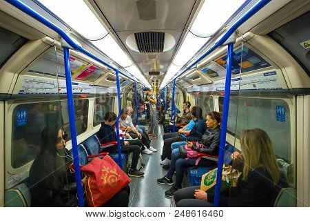 London, United Kingdom - May 12 2018: Commuters Travel By Using Underground Train In The City Of Lon