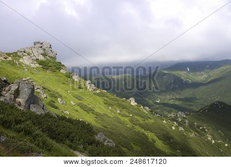 Photo Of Mountain Landscape In The Summer Under Beautiful Rainy Sky. Ukraine, Carpathians, Dzembroni
