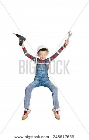 Boy Builder Installer Rejoices Raised His Hands To The Top With Tools In His Hands