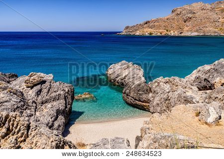 Amazing Ammoudi Beach With Turquoise Water And Beautiful View In Crete Island, Greece .