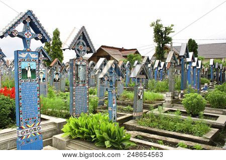 ROMANIA - 25 JULY, 2017: Painted wooden crosses in Merry Cemetery, Sapanta, Maramures 