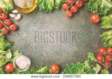 Green Salad Frame On Dark Stobe Background, Top View With Copy Space. Spring Mix. Fresh Green Salad.