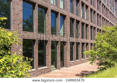 Office Building In Loft Style. Apartment In A Brick Building. Large Windows