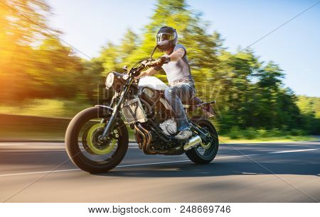Motorbike On The Road Riding. Having Fun Riding The Empty Road On A Motorcycle Tour / Journey