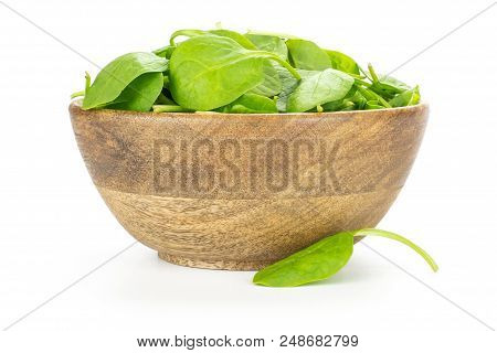 Fresh Baby Spinach Leaves In A Wooden Bowl And One Leaf Is Near Isolated On White Background