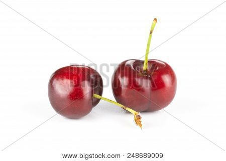 Group Of Two Whole Sweet Bright Red Cherry Isolated On White