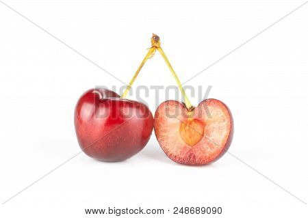 Group Of One Whole One Half Of Sweet Bright Red Cherry Isolated On White