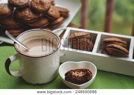 Fudge Brownie Cookies With Penut And Cheese Filling On White Plate On Wooden Background With Cacao O