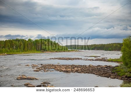 Katkasuvanto River Is Border Between Finland And Sweden And Dramatic Sky