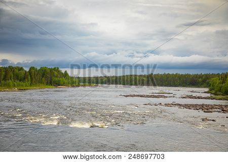 Katkasuvanto River Is Border Between Finland And Sweden And Dramatic Sky