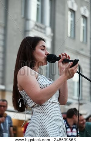 Moscow, Russia - June 23, 2018: Girl Street Singer Performs On A Street In Moscow At Night Start