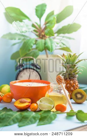 Useful Morning Breakfast, Muesli, Fruit Peaches Lime Pineapple Honey Cup Of Coffee And An Alarm Cloc