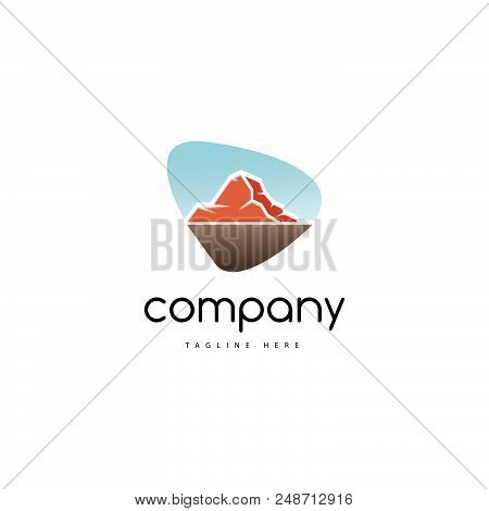 On The Logo Is An Abstract Image Of The Mountain Against The Background Of A Clear Sky.