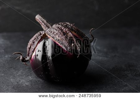 Fresh Italian Type Eggplant Or Aubergine With Water Drops Closeup On Black Background